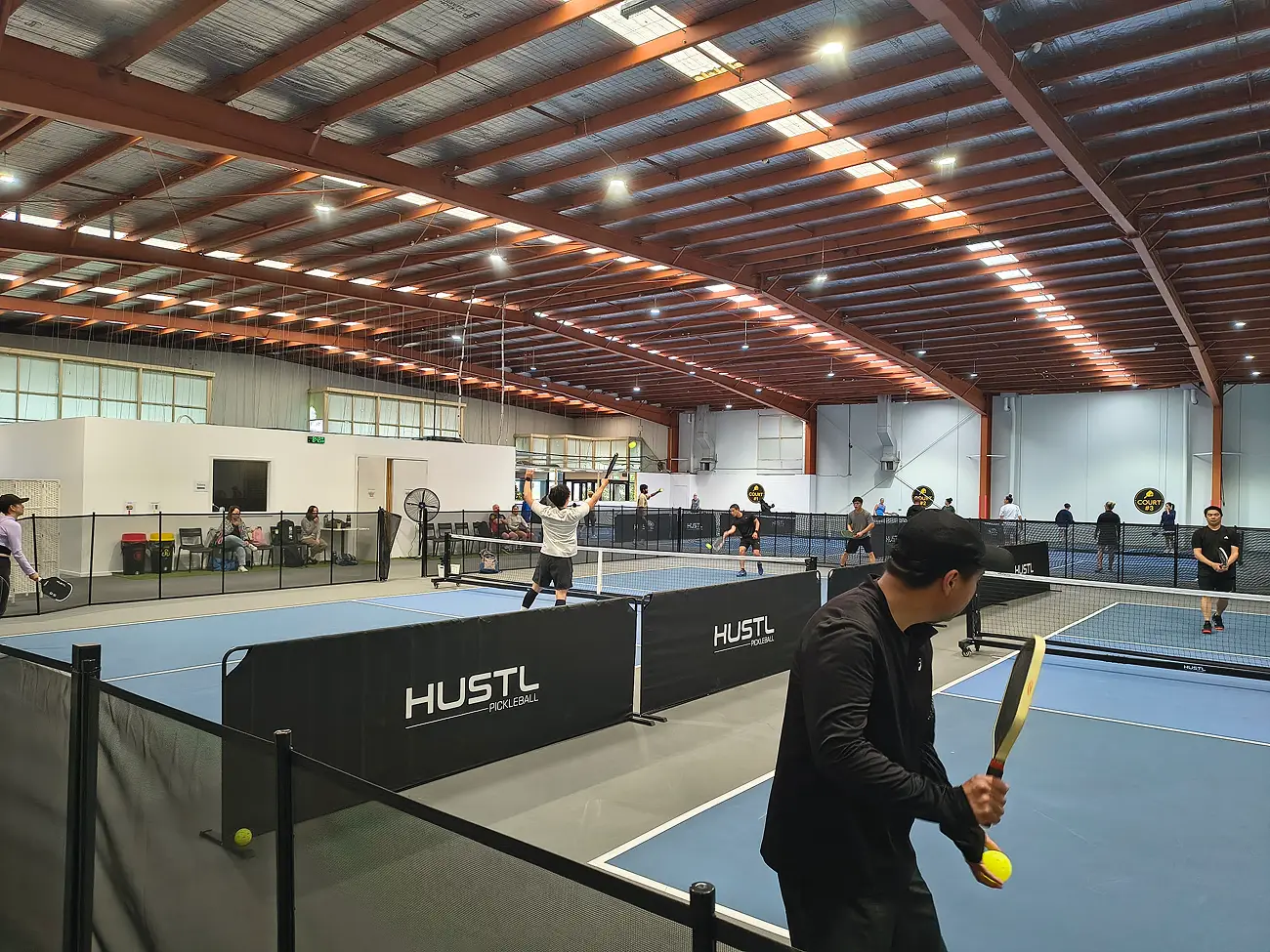 Players competing in matches during a local first pickleball tournament at Pickleplay Dingley